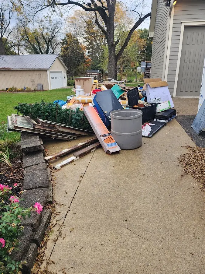 Dumpster being loaded with debris for 12 Yard Dumpster Rental in El Segundo